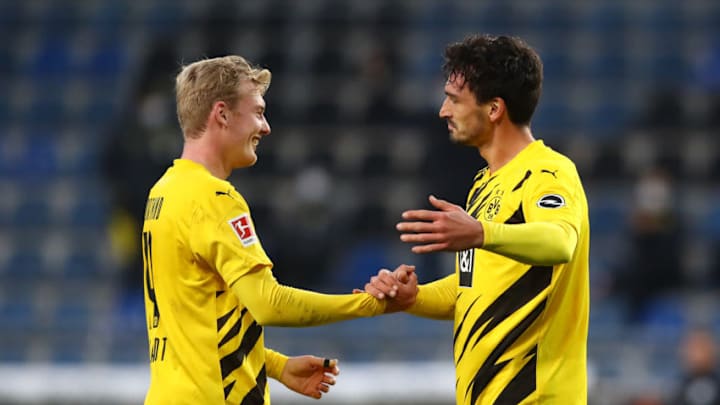 BIELEFELD, GERMANY - OCTOBER 31: Mats Hummels of Borussia Dortmund celebrates with teammate Julian Brandt after he scores his team's second goal during the Bundesliga match between DSC Arminia Bielefeld and Borussia Dortmund at Schueco Arena on October 31, 2020 in Bielefeld, Germany. Sporting stadiums around Germany remain under strict restrictions due to the Coronavirus Pandemic as Government social distancing laws prohibit fans inside venues resulting in games being played behind closed doors. (Photo by Martin Rose/Getty Images)
