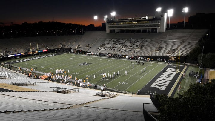 Vanderbilt and Tennessee players huddle during a break in the action in a near-empty Vanderbilt Stadium during the third quarter Saturday, Dec. 12, 2020 in Nashville, Tenn.Gw56134