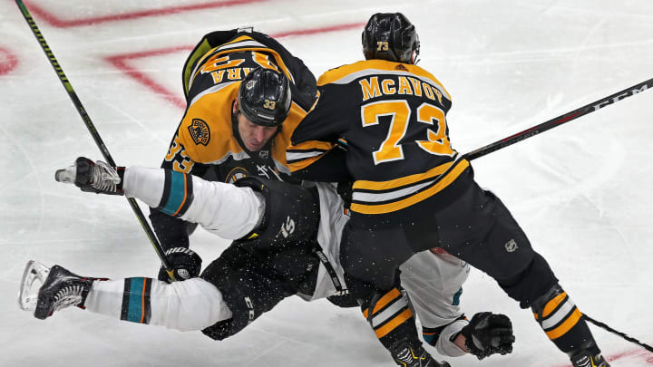 BOSTON - FEBRUARY 26: Boston Bruins defensemen Zdeno Chara (33) and Charlie McAvoy (73) combine to level the Sharks' Timo Meier in the second period. The Boston Bruins host the San Jose Sharks in a regular season NHL hockey game at TD Garden in Boston on Feb. 26, 2019. (Photo by Jim Davis/The Boston Globe via Getty Images)