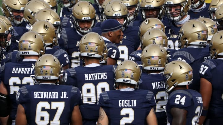 ANNAPOLIS, MARYLAND - OCTOBER 24: The Navy Midshipmen huddle up before playing against the Houston Cougars during the first half at Navy-Marine Corps Memorial Stadium on October 24, 2020 in Annapolis, Maryland. (Photo by Patrick Smith/Getty Images)