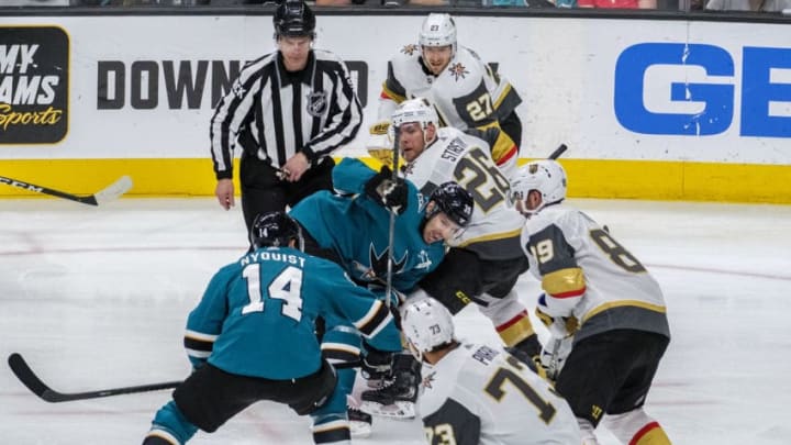 SAN JOSE, CA - APRIL 23: Vegas Golden Knights center Paul Stastny (26) and San Jose Sharks center Logan Couture (39) try to position the puck to their teammates during Game 7, Round 1 between the Vegas Golden Knights and the San Jose Sharks on Tuesday, April 23, 2019 at the SAP Center in San Jose, California. (Photo by Douglas Stringer/Icon Sportswire via Getty Images)