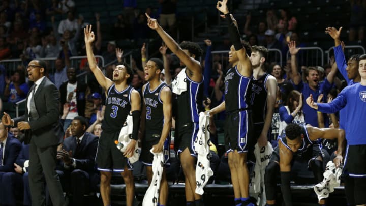 MIAMI, FLORIDA - JANUARY 04: Tre Jones #3, Cassius Stanley #2, Vernon Carey Jr. #1, Wendell Moore Jr. #0 and Javin DeLaurier #12 of the Duke Blue Devils react after a basket against the Miami Hurricanes during the second half at the Watsco Center on January 04, 2020 in Miami, Florida. (Photo by Michael Reaves/Getty Images)