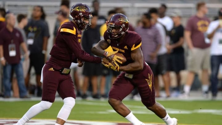 Sep 24, 2016; Tempe, AZ, USA; Arizona State Sun Devils quarterback Manny Wilkins (5) hands off the ball to Arizona State Sun Devils running back Kalen Ballage (7) during warmups prior to facing the California Golden Bears at Sun Devil Stadium. Mandatory Credit: Joe Camporeale-USA TODAY Sports