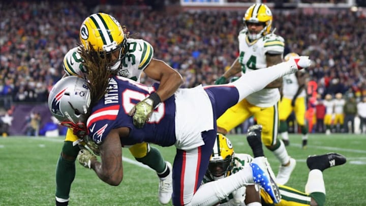 FOXBOROUGH, MA - NOVEMBER 04: Tramon Williams #38 of the Green Bay Packers tackles Cordarrelle Patterson #84 of the New England Patriots during the first half at Gillette Stadium on November 4, 2018 in Foxborough, Massachusetts. (Photo by Maddie Meyer/Getty Images)