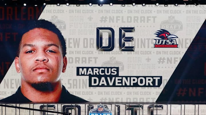 ARLINGTON, TX - APRIL 26: A video board displays an image of Marcus Davenport of UTSA after he was picked