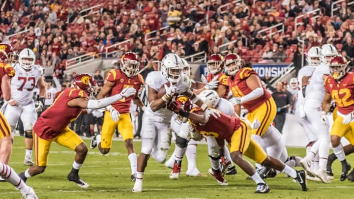 SANTA CLARA, CA - DECEMBER 01: Stanford Cardinal running back Bryce Love (20) breaks through the USC Trojans line and heads toward the end zone during the PAC-12 Championship game between the USC Trojans and the Stanford Cardinals on Friday, December 01, 2017 at Levi's Stadium in Santa Clara, CA. (Photo by Douglas Stringer/Icon Sportswire via Getty Images)
