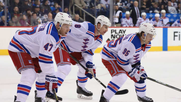 WINNIPEG, MB - FEBRUARY 11: Steven Kampfer #47, Cody McLeod #8 and Vinni Lettieri #95 of the New York Rangers get set for a first period face-off against the Winnipeg Jets at the Bell MTS Place on February 11, 2018 in Winnipeg, Manitoba, Canada. The Rangers defeated the Jets 3-1. (Photo by Darcy Finley/NHLI via Getty Images)