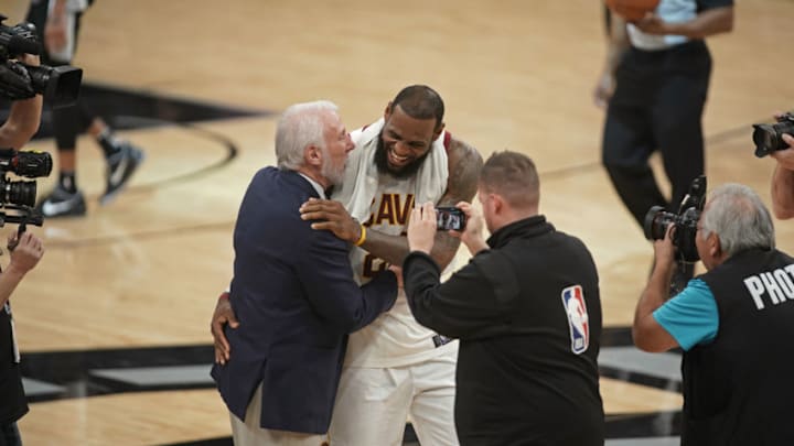 SAN ANTONIO, TX - JANUARY 23: LeBron James #23 of the Cleveland Cavaliers high fives Gregg Popovich of the San Antonio Spurs on January 23, 2018 at the AT&T Center in San Antonio, Texas. NOTE TO USER: User expressly acknowledges and agrees that, by downloading and/or using this photograph, user is consenting to the terms and conditions of the Getty Images License Agreement. Mandatory Copyright Notice: Copyright 2018 NBAE (Photo by Darren Carroll/NBAE via Getty Images)
