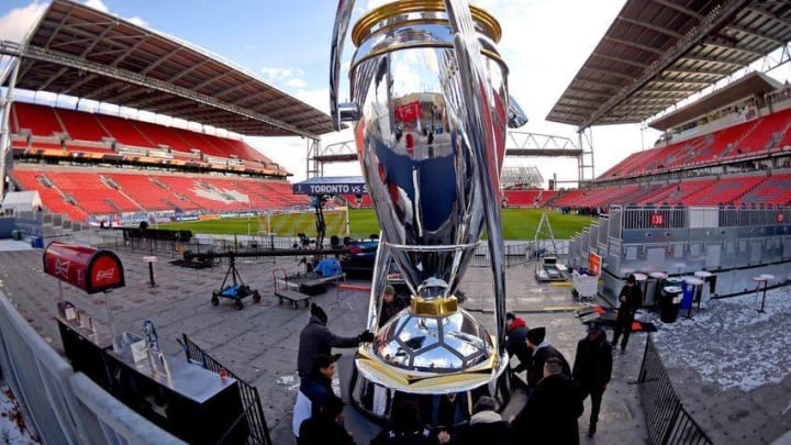 Dec 9, 2016; Toronto, Ontario, USA; Stadium workers position a giant replica of the MLS Cup trophy after training sessions in preparations for the MLS Cup final between Seattle Sounders and Toronto FC at BMO Field. Mandatory Credit: Dan Hamilton-USA TODAY Sports