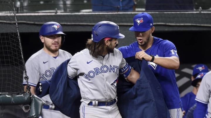 Jose Berrios #17 of the Toronto Blue Jays puts the home run jacket on Bo Bichette. (Photo by Greg Fiume/Getty Images)