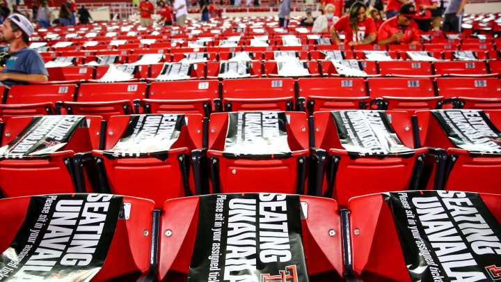 “Seating Unavailable” signs occupy seats during the college football game between the Texas Tech Red Raiders the Houston Baptist Huskies on September 12, 2020 at Jones AT&T Stadium in Lubbock, Texas. (Photo by John E. Moore III/Getty Images)