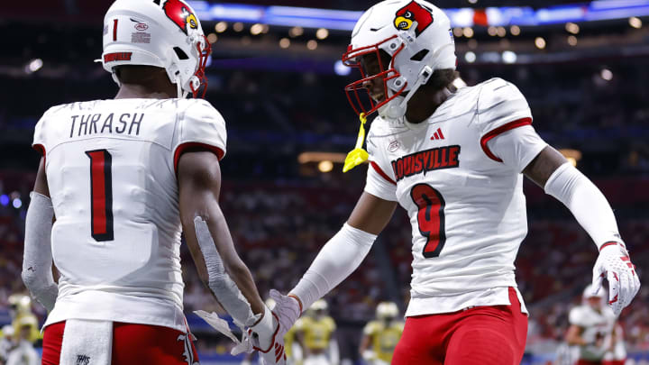 ATLANTA, GEORGIA – SEPTEMBER 1: Jamari Thrash #1 of the Louisville Cardinals reacts after his touchdown with Ahmari Huggins-Bruce #9 during the second half against the Georgia Tech Yellow Jackets at Mercedes-Benz Stadium on September 1, 2023 in Atlanta, Georgia. (Photo by Todd Kirkland/Getty Images)