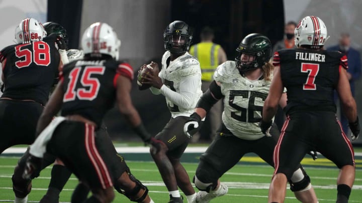 Dec 3, 2021; Las Vegas, NV, USA; Oregon Ducks quarterback Anthony Brown (13) throws the ball against the Utah Utes in the first half during the 2021 Pac-12 Championship Game at Allegiant Stadium. Mandatory Credit: Kirby Lee-USA TODAY Sports