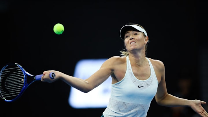 BEIJING, CHINA - OCTOBER 04: Maria Sharapova of Russia returns a shot against Simona Halep of Romania during the Women's singles 3rd round on day five of 2017 China Open at the China National Tennis Centre on October 4, 2017 in Beijing, China. (Photo by Lintao Zhang/Getty Images)