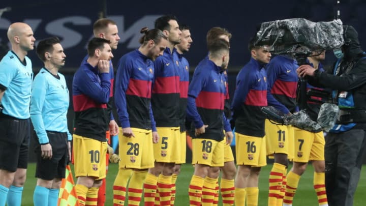 Lionel Messi #10 of FC Barcelona pose with teammates. (Photo by Xavier Laine/Getty Images)