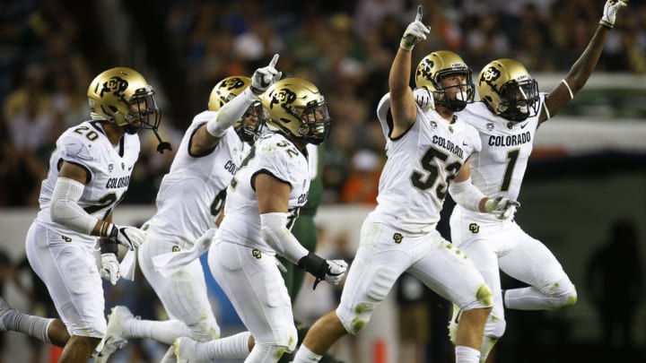 DENVER, CO linebacker Nate Landman #53 of the Colorado Buffaloes and defensive back Delrick Abrams Jr. #1 of the Colorado Buffaloes and teammates celebrate Landman’s interception against the Colorado State Rams in the second quarter at Broncos Stadium at Mile High on August 31, 2018 in Denver, Colorado. (Photo by Joe Mahoney/Getty Images)
