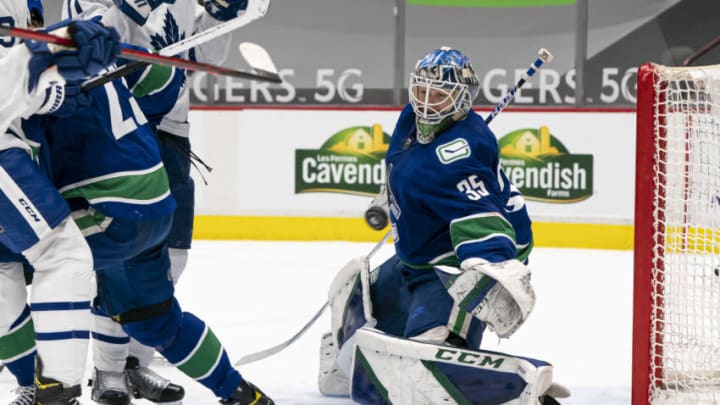 VANCOUVER, BC - MARCH 04: Goalie Thatcher Demko #35 of the Vancouver Canucks stretches to make a save against the Toronto Maple Leafs during NHL hockey action at Rogers Arena on March 4, 2021 in Vancouver, Canada. (Photo by Rich Lam/Getty Images)
