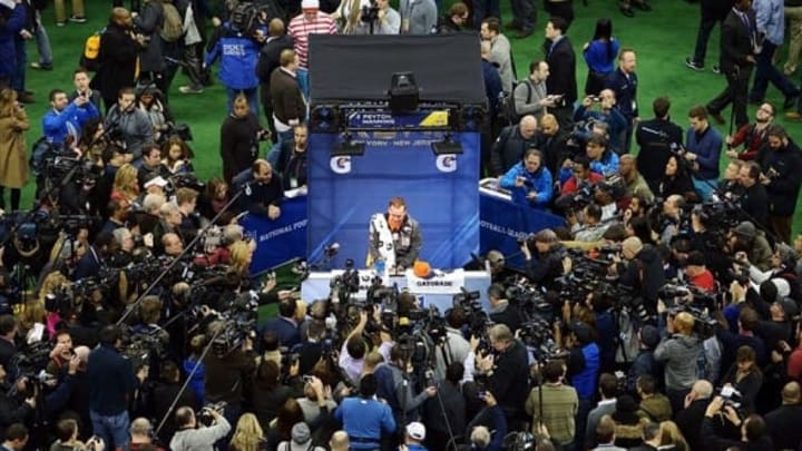 Jan 28, 2014; Newark, NJ, USA; Denver Broncos quarterback Peyton Manning is interviewed during Media Day for Super Bowl XLIII at Prudential Center. Mandatory Credit: Kirby Lee-USA TODAY Sports