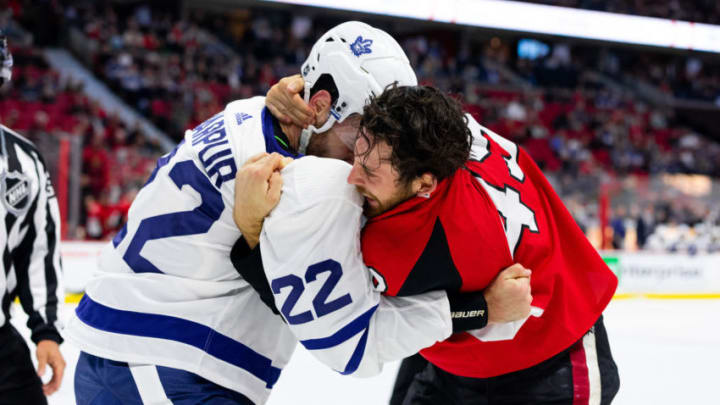 OTTAWA, ON - SEPTEMBER 18: Toronto Maple Leafs defenseman Ben Harpur (22) and Ottawa Senators right wing Scott Sabourin (49) grapple in a fight during first period National Hockey League preseason action between the Toronto Maple Leafs and Ottawa Senators on September 18, 2019, at Canadian Tire Centre in Ottawa, ON, Canada. (Photo by Richard A. Whittaker/Icon Sportswire via Getty Images)