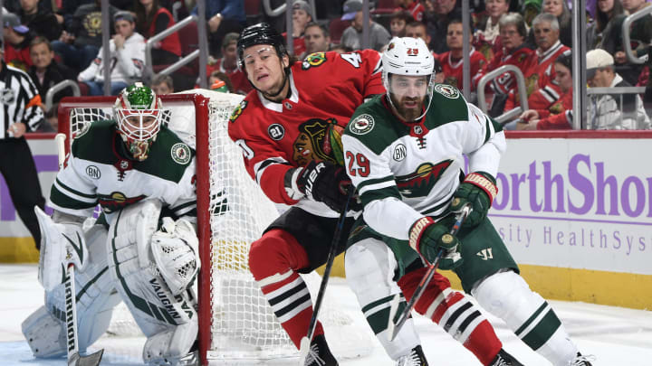 CHICAGO, IL - NOVEMBER 18: John Hayden #40 of the Chicago Blackhawks and Greg Pateryn #29 of the Minnesota Wild skate around the net guarded by goalie Alex Stalock #32 in the first period at the United Center on November 18, 2018 in Chicago, Illinois. (Photo by Bill Smith/NHLI via Getty Images)