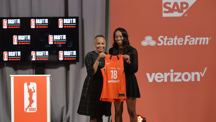 NEW YORK, NY – APRIL 12: Lexie Brown stands with WNBA President Lisa Borders after being selected