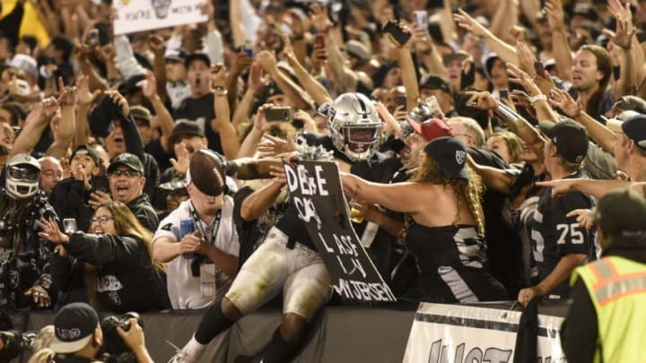 OAKLAND, CA - SEPTEMBER 9: Josh Jacobs (28) of the Oakland Raiders celebrates a touchdown run against the Denver Broncos with fans during the second half of the Raiders' 24-16 win on Monday, September 9, 2019. (Photo by AAron Ontiveroz/The Denver Post)