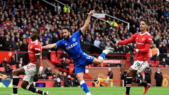 Everton's English striker Andros Townsend (C) scores his team's first goal during the English Premier League football match between Manchester United and Everton at Old Trafford in Manchester, north west England, on October 2, 2021. - RESTRICTED TO EDITORIAL USE. No use with unauthorized audio, video, data, fixture lists, club/league logos or 'live' services. Online in-match use limited to 120 images. An additional 40 images may be used in extra time. No video emulation. Social media in-match use limited to 120 images. An additional 40 images may be used in extra time. No use in betting publications, games or single club/league/player publications. (Photo by Oli SCARFF / AFP) / RESTRICTED TO EDITORIAL USE. No use with unauthorized audio, video, data, fixture lists, club/league logos or 'live' services. Online in-match use limited to 120 images. An additional 40 images may be used in extra time. No video emulation. Social media in-match use limited to 120 images. An additional 40 images may be used in extra time. No use in betting publications, games or single club/league/player publications. / RESTRICTED TO EDITORIAL USE. No use with unauthorized audio, video, data, fixture lists, club/league logos or 'live' services. Online in-match use limited to 120 images. An additional 40 images may be used in extra time. No video emulation. Social media in-match use limited to 120 images. An additional 40 images may be used in extra time. No use in betting publications, games or single club/league/player publications. (Photo by OLI SCARFF/AFP via Getty Images)