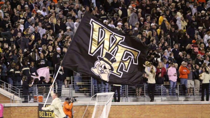 Oct 15, 2011; Winston-Salem, NC, USA; The Wake Forest Demon Deacons flag is ran across the field after a touchdown during the third quarter at BB&T Field. The Virginia Tech Hokies defeated the Wake Forest Demon Deacons 38-17. Mandatory Credit: Jeremy Brevard-USA TODAY Sports