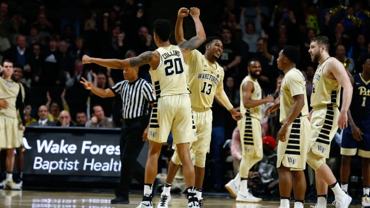 Feb 22, 2017; Winston-Salem, NC, USA; Wake Forest Demon Deacons forward John Collins (20) celebrates with guard Bryant Crawford (13) in the second half against the Pittsburgh Panthers at Lawrence Joel Veterans Memorial Coliseum. Wake defeated Pitt 63-59. Mandatory Credit: Jeremy Brevard-USA TODAY Sports