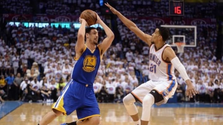 May 24, 2016; Oklahoma City, OK, USA; Golden State Warriors guard Klay Thompson (11) handles the ball against Oklahoma City Thunder guard Andre Roberson (21) during the third quarter in game four of the Western conference finals of the NBA Playoffs at Chesapeake Energy Arena. Mandatory Credit: Mark D. Smith-USA TODAY Sports