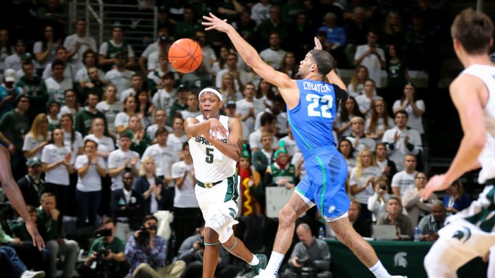 EAST LANSING, MI – NOVEMBER 11: Cassius Winston #5 of the Michigan State Spartans passes the ball while defended by Haanif Cheatham #22 of the Florida Gulf Coast Eagles in the first half at Breslin Center on November 11, 2018 in East Lansing, Michigan. (Photo by Rey Del Rio/Getty Images)