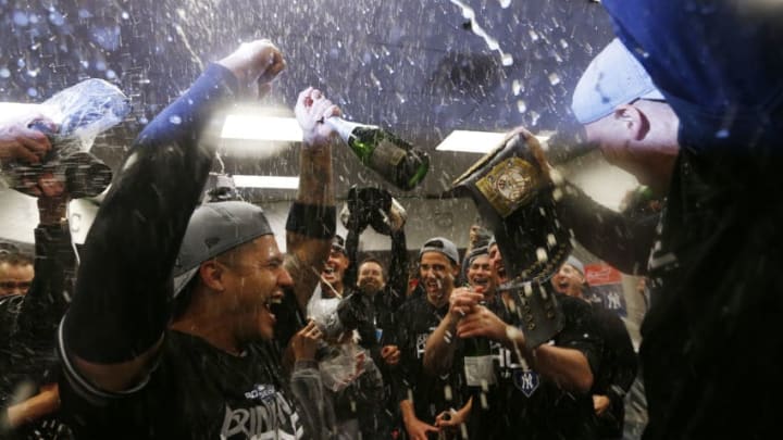 MINNEAPOLIS, MINNESOTA - OCTOBER 07: Gleyber Torres #25 of the New York Yankees celebrates with teammates in the locker room after sweeping the Minnesota Twins 3-0 in the American League Division Series to advance to the American League Championship Series at Target Field on October 07, 2019 in Minneapolis, Minnesota. (Photo by Elsa/Getty Images)