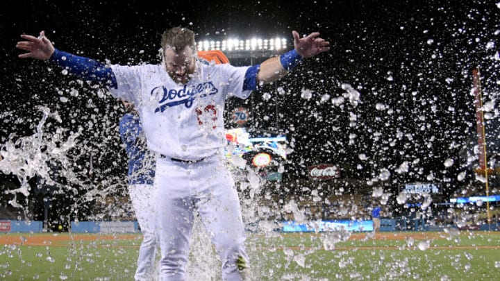 LOS ANGELES, CALIFORNIA - AUGUST 21: Max Muncy #13 of the Los Angeles Dodgers celebrates his walk off solo homerun to beat the Toronto Blue Jays 2-1 during the 10th inning at Dodger Stadium on August 21, 2019 in Los Angeles, California. (Photo by Harry How/Getty Images)