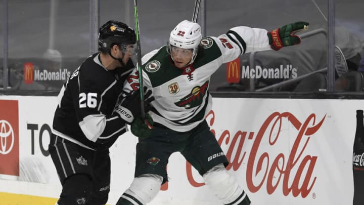 Minnesota's Kevin Fiala, right, fends off Sean Walker during a matchup in Los Angeles last season. The Wild will open this year on the West Coast again, which means late faceoff times..(Photo by Harry How/Getty Images)