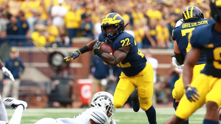 ANN ARBOR, MI - SEPTEMBER 08: Karan Higdon #22 of the Michigan Wolverines runs the ball for a first down in the first quarter against the Western Michigan Broncos at Michigan Stadium on September 8, 2018 in Ann Arbor, Michigan. (Photo by Rey Del Rio/Getty Images)