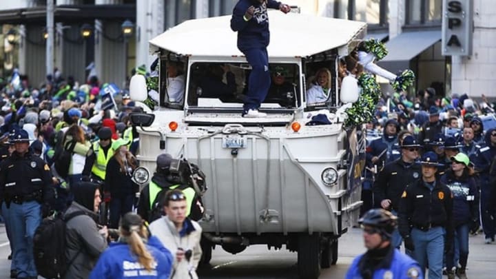 Feb 5, 2014; Seattle, WA, USA; Seattle Seahawks running back Marshawn Lynch (24) dances on top of a Duckmobile during a Super Bowl championship parade held in downtown Seattle. Mandatory Credit: Joe Nicholson-USA TODAY Sports