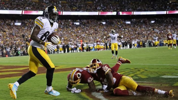Sep 12, 2016; Landover, MD, USA; Pittsburgh Steelers wide receiver Antonio Brown (84) catches a touchdown pass as Washington Redskins safety DeAngelo Hall (23) and Redskins cornerback Bashaud Breeland (26) defend in the second quarter at FedEx Field. Mandatory Credit: Geoff Burke-USA TODAY Sports