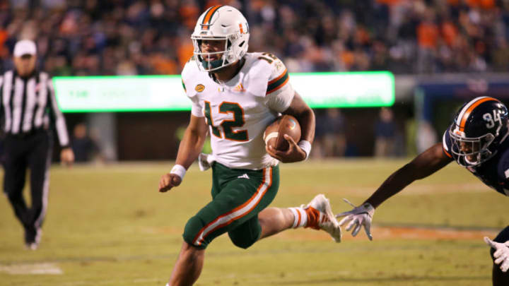 CHARLOTTESVILLE, VA - OCTOBER 13: Malik Rosier #12 of the Miami Hurricanes rushes for a touchdown in the second half during a game against the Virginia Cavaliers at Scott Stadium on October 13, 2018 in Charlottesville, Virginia. (Photo by Ryan M. Kelly/Getty Images)