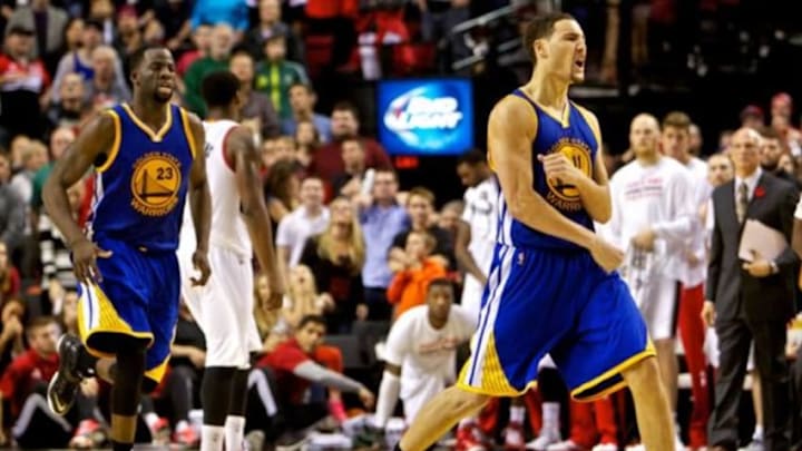 Nov 2, 2014; Portland, OR, USA; Golden State Warriors guard Klay Thompson (11) reacts after making the game winning shot against the Portland Trail Blazers during the fourth quarter at the Moda Center. Mandatory Credit: Craig Mitchelldyer-USA TODAY Sports