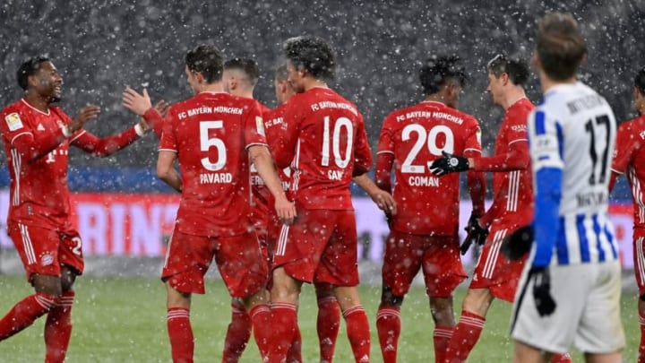 Bayern Munich players celebrating Kingsley Coman's goal against Hertha Berlin. (Photo by JOHN MACDOUGALL/POOL/AFP via Getty Images)