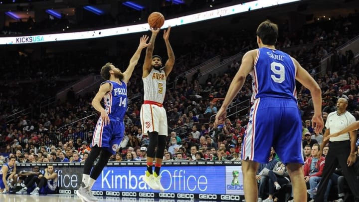 Oct 29, 2016; Philadelphia, PA, USA; Atlanta Hawks guard Malcolm Delaney (5) shoots as Philadelphia 76ers guard Sergio Rodriguez (14) defends during the fourth quarter of the game at the Wells Fargo Center. The Atlanta Hawks won 104-72. Mandatory Credit: John Geliebter-USA TODAY Sports