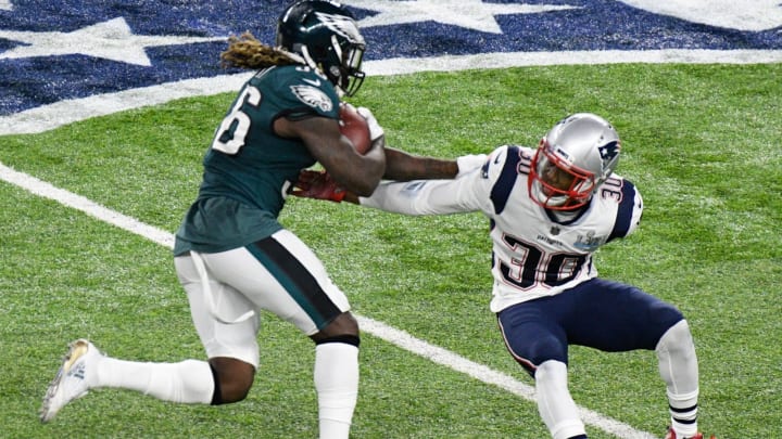 MINNEAPOLIS, MN – FEBRUARY 04: Jay Ajayi #36 of the Philadelphia Eagles carries the ball against Duron Harmon #30 of the New England Patriots during the first half in Super Bowl LII at U.S. Bank Stadium on February 4, 2018 in Minneapolis, Minnesota. (Photo by Hannah Foslien/Getty Images)