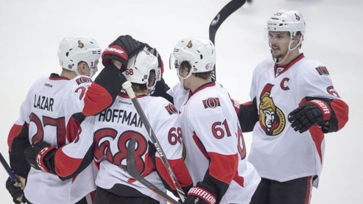 Nov 24, 2015; Dallas, TX, USA; Ottawa Senators left wing Mike Hoffman (68) celebrates with right wing Curtis Lazar (27), right wing Mark Stone (61), and defenseman Erik Karlsson (65) after scoring a goal against the Dallas Stars during the second period at the American Airlines Center. Mandatory Credit: Jerome Miron-USA TODAY Sports