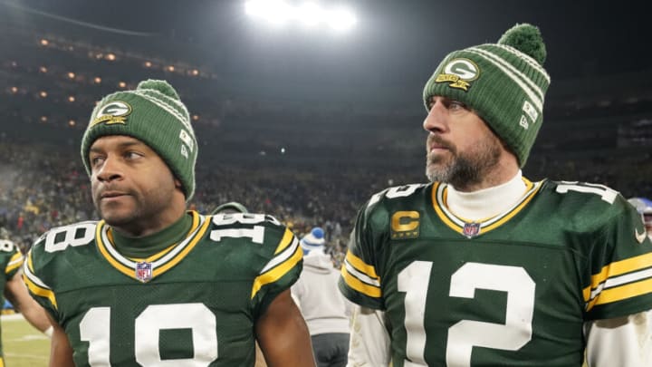 GREEN BAY, WISCONSIN - JANUARY 08: Aaron Rodgers #12 and Randall Cobb #18 of the Green Bay Packers walk off the field after losing to the Detroit Lions at Lambeau Field on January 08, 2023 in Green Bay, Wisconsin. (Photo by Patrick McDermott/Getty Images)