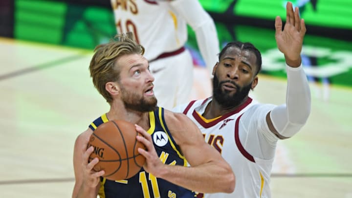 Dec 14, 2020; Cleveland, Ohio, USA; Indiana Pacers forward Domantas Sabonis (11) goes to the basket against Cleveland Cavaliers center Andre Drummond (3) during the first quarter at Rocket Mortgage FieldHouse. Mandatory Credit: David Dermer-USA TODAY Sports