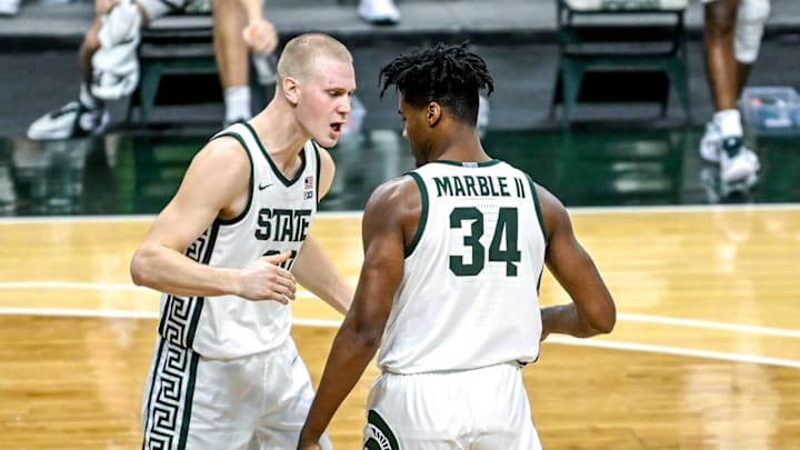 Michigan State’s Joey Hauser, left, celebrates after Julius Marble is fouled on a shot against Notre Dame during the second half on Saturday, Nov. 28, 2020, at the Breslin Center in East Lansing.201128 Msu Notre Dame 075a