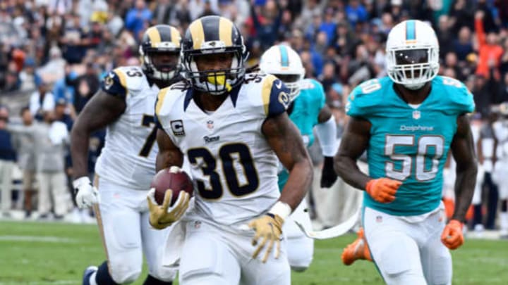 Nov 20, 2016; Los Angeles, CA, USA; Los Angeles Rams running back Todd Gurley (30) races down the field on his way to a 24-yard touchdown in the first quarter against the Miami Dolphins at Los Angeles Memorial Coliseum. Mandatory Credit: Robert Hanashiro-USA TODAY Sports