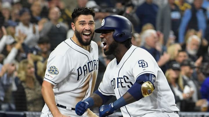 SAN DIEGO, CA - APRIL 23: Franmil Reyes #32 (R) of the San Diego Padres celebrates with Eric Hosmer #30 after hitting a solo home run during the sixth inning of a baseball game against the Seattle Mariners at Petco Park April 23, 2019 in San Diego, California. (Photo by Denis Poroy/Getty Images)