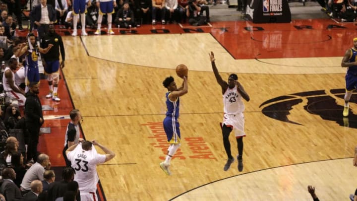 TORONTO, CANADA - JUNE 2: Quinn Cook #4 of the Golden State Warriors shoots three point basket against the Toronto Raptors during Game Two of the NBA Finals on June 2, 2019 at Scotiabank Arena in Toronto, Ontario, Canada. NOTE TO USER: User expressly acknowledges and agrees that, by downloading and/or using this photograph, user is consenting to the terms and conditions of the Getty Images License Agreement. Mandatory Copyright Notice: Copyright 2019 NBAE (Photo by Carlos Osorio/NBAE via Getty Images)