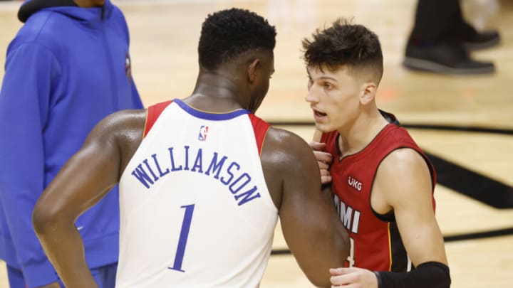 Tyler Herro (14) of the Miami Heat greets Zion Williamson (1) after the game (Photo by Michael Reaves/Getty Images)